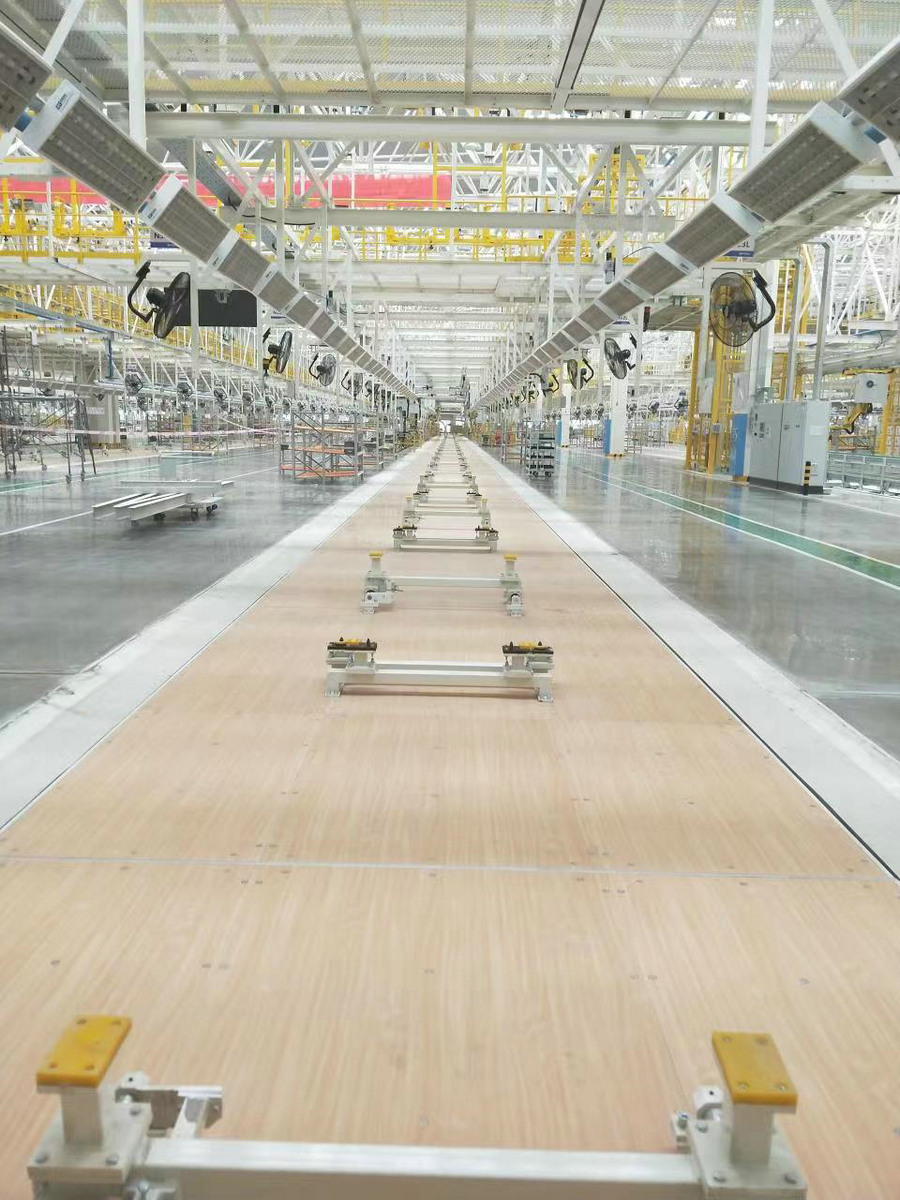 Friction skateboard conveyor